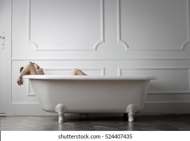 Girl relaxing in a bathtub
