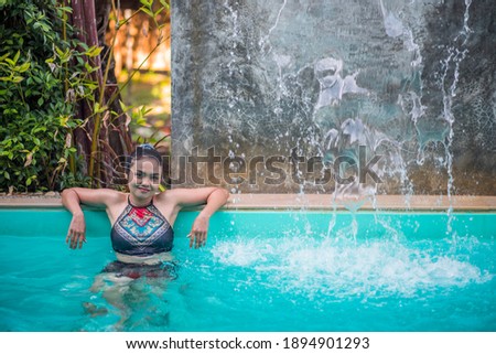 
A girl relaxing by the pool