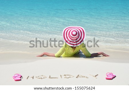 Girl relaxing on the beach of Exuma, Bahamas 