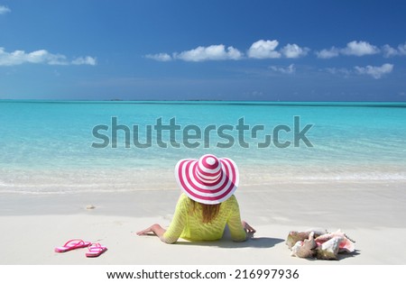 Girl relaxing on the beach of Exuma, Bahamas