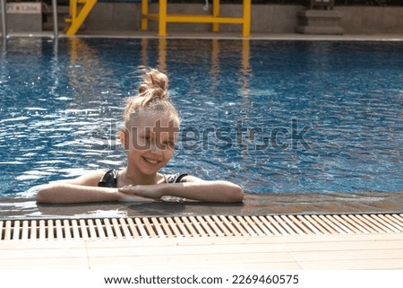 the girl is resting on vacation in Thailand, the girl is swimming in the pool