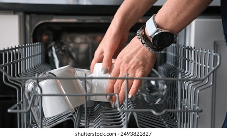 Girl Retrieves Clean Cap From Dishwasher In Close-Up View - Powered by Shutterstock