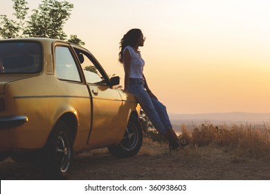 Girl And Retro Car During Sunset