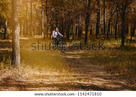 Similar – Image, Stock Photo Woman with a bike in the middle of the forest.