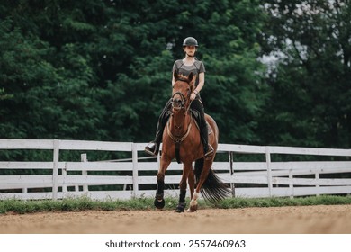 Girl riding a brown horse at a ranch, showcasing equestrian skills and training on a sunny day. - Powered by Shutterstock