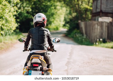 girl riding on back of motorcycle