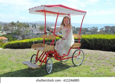 Girl Riding Surrey Bike 