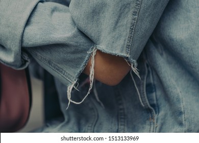 Girl In Ripped Denim Jacket