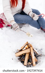 Girl Is Roasting Marshmallows On An Open Fire In Winter