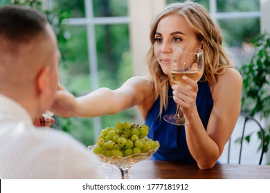 Girl. Romantic Dinner For A Couple In Love In A Beautiful Country House. Lovers Drink Wine From Glasses.