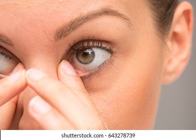 Girl Rubbing Her Eyes