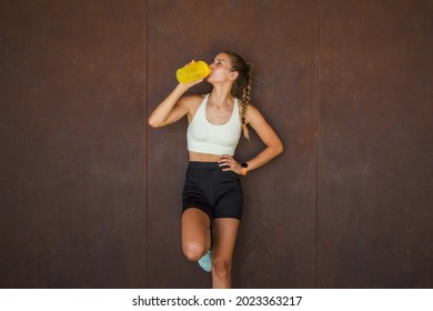 Girl Runner Hydrates After Exercise