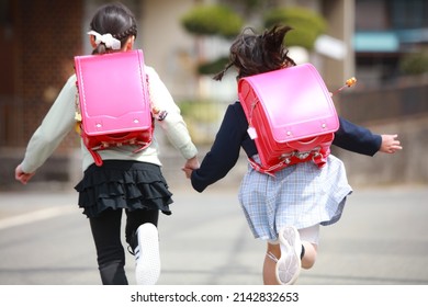 Girl running hand in hand
 - Shutterstock ID 2142832653