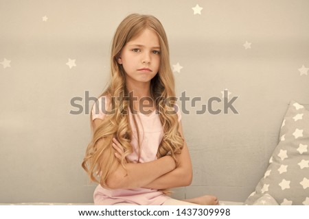 Girl sad with long curly hair hold hands crossed on chest. Things you shouldnt do at night if you want healthier hair. How to style hair before go to bed. Easy way keep nice hairstyle. Hair care tips.