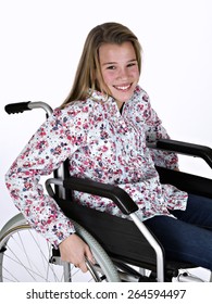 Girl Sat In A Wheelchair, On White Background