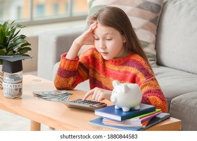 Girl With Savings For Education And Calculator At Home