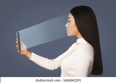 Girl Scanning Face With Facial Recognition System On Smartphone, Side View. Biometric Identification Concept