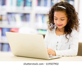 Girl at school using a laptop cpmputer - Powered by Shutterstock