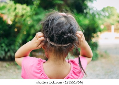 A Girl Scratch On Her Hair. The Head Lice Makes Itself At Home On The Kids Hair.This Annoying Parasite Can Cause Itching And Other Mild Symptoms.