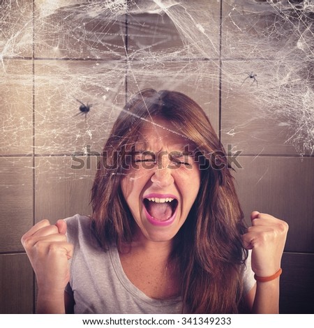 Girl screaming trapped in a spider web