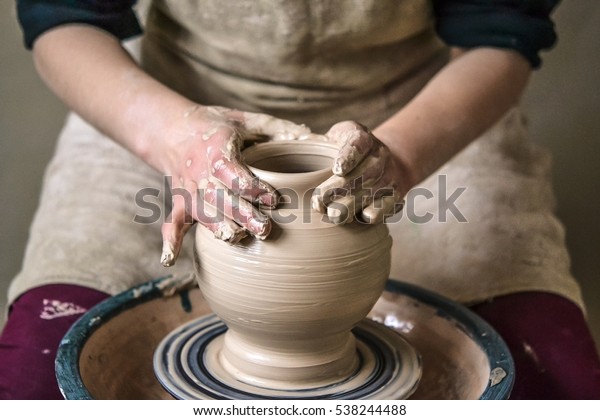 Girl\
sculpts in clay pot closeup. Modeling clay close-up. Caucasian man\
making vessel daytime of white clay in fast moving circle. Art,\
creativity. Ukraine, cultural traditions.\
Hobbies