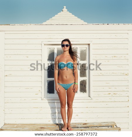 Similar – Surfer woman with top and bikini holding surfboard