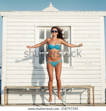 Similar – Surfer woman with top and bikini holding surfboard