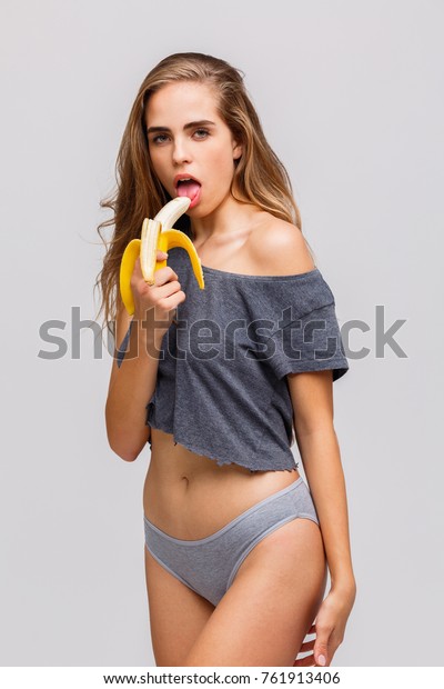Girl Licking Banana On White Foto de stock 761913406 | Shutterstock