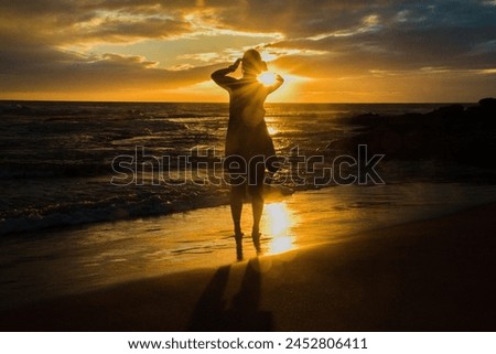 Girl shape in the sunset