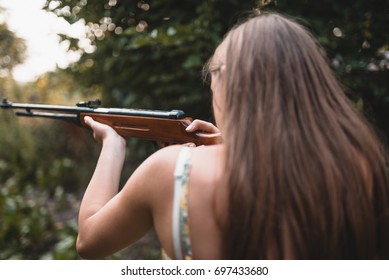 Girl Shooting Gun From Behind