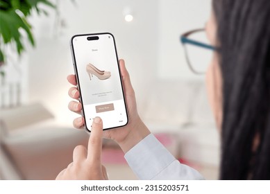 Girl shopping online on ecommerce website. Looking for shoes for a night out. Modern app interface