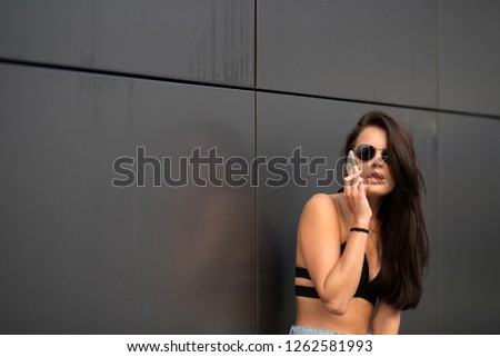 Similar – Young surfer woman with top and bikini kissing surfboard