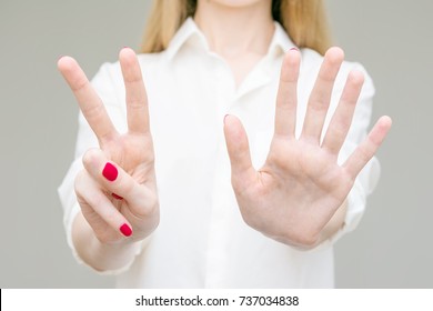 girl-showing-gesture-number-7-260nw-737034838.jpg