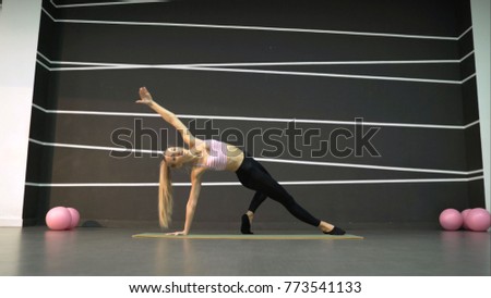 Similar – Close up side view profile portrait of one young middle age athletic woman shadow boxing in sportswear in gym over dark background, looking away