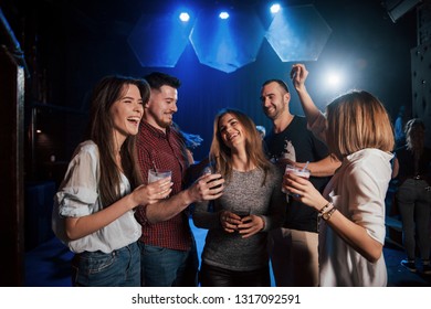 Girl Is Too Shy To Dance. Beautiful Youth Have Party Together With Alcohol In The Nightclub.