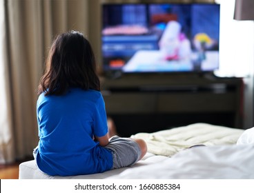 Girl Sit On Bed Focus Watching TV In Room Alone In Family Careless And TV Addiction Concept