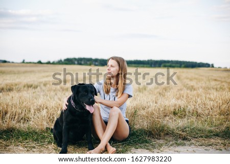 Similar – Foto Bild Glücklicher lächelnder Hund mit seinem hübschen jungen Besitzer