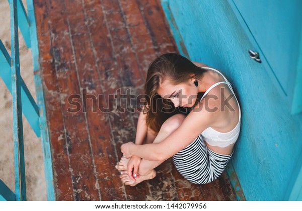 Girl Sitting On Beach Her Legs Stock Photo (Edit Now) 1442079956