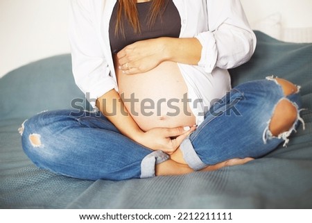 Similar – Pregnant woman embraced by her husband