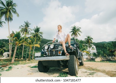 Girl Sitting On The Car, Jeep On The Beach. Lifestyle
