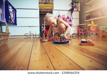 Similar – Baby Mädchen spielt mit Haarspangen, die auf dem Boden liegen.