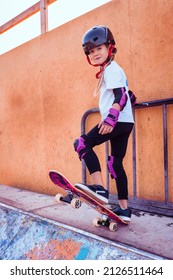 Girl With Skateboard In The Park