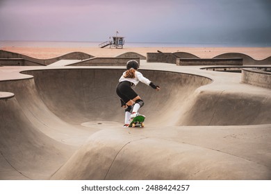 Girl skateboarding at Venice Beach's skate park. - Powered by Shutterstock