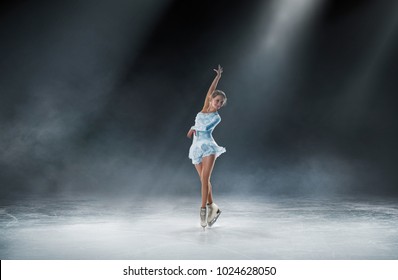 girl skating at ice arena - Shutterstock ID 1024628050