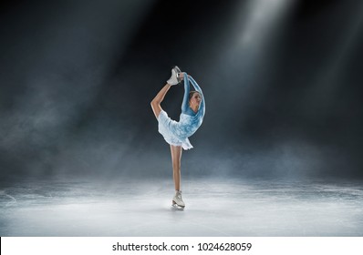 girl skating at ice arena - Shutterstock ID 1024628059