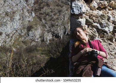 Girl Sleep In The Sun After A Research Nature. Wild Life Professional Photographer. Fieldwork Biologist. Biologist Photographing In Nature. Relaxed Young Woman Sitting In Pa