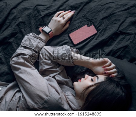 girl sleep with telephone and watches