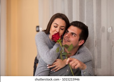 The Girl Smells Like A Red Rose, The Guy Gives The Girl A Rose.