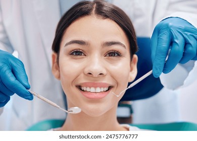 Girl, smile and dentist with equipment in clinic with oral health, healthcare and dental care. Patient, happy and portrait in hospital for cleaning, veneers or teeth whitening with excavator by mouth - Powered by Shutterstock