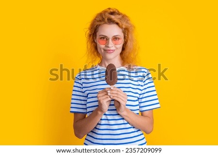 girl smile with icelolly ice cream isolated on yellow. girl with icelolly ice cream in studio.